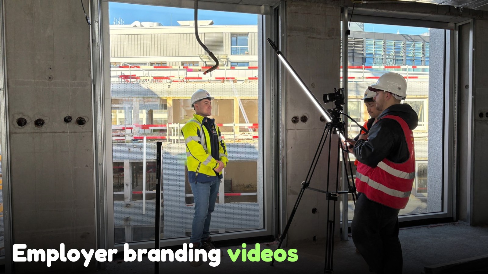 Film crew shooting an interview at the Deloitte Job & Internship Fair, with professional lighting and a gimbal.